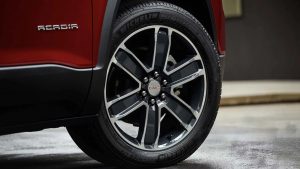 Close-up image of a GMC Acadia left-rear tire.