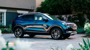 Blue Buick Encore GX parked in a driveway.